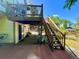 Relaxing backyard deck area with stairs to the lawn, ideal for outdoor entertainment and enjoyment at 9466 Morning Glory Ln, Highlands Ranch, CO 80130