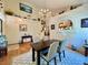 Bright dining area with high ceilings, chandelier, and views of the staircase at 9466 Morning Glory Ln, Highlands Ranch, CO 80130