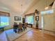 Inviting dining space with hardwood floors, a chandelier, and a large window at 9466 Morning Glory Ln, Highlands Ranch, CO 80130