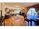 Comfortable living room with a fireplace, large windows, and access to an outdoor deck at 9466 Morning Glory Ln, Highlands Ranch, CO 80130