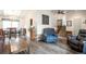 Spacious living room with modern furniture and hardwood flooring at 10991 E Vassar Dr, Aurora, CO 80014