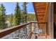 Balcony with views of the surrounding forest and snow-capped mountains at 563 Brook Dr, Idaho Springs, CO 80452