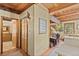 Hallway features wood trim, adjoining rooms, and natural light at 563 Brook Dr, Idaho Springs, CO 80452