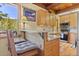 Charming kitchen bar with seating, offering a cozy spot to enjoy meals and mountain views at 563 Brook Dr, Idaho Springs, CO 80452