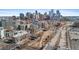 Expansive aerial view showcases the city skyline with adjacent buildings, roads and foliage at 1438 Little Raven St # 407, Denver, CO 80202