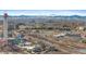 An elevated view shows the waterpark, an outdoor park area, buildings and distant snow-capped mountains at 1438 Little Raven St # 407, Denver, CO 80202