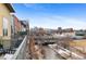 Balcony view overlooking the city, with a river and walking path below at 1438 Little Raven St # 407, Denver, CO 80202