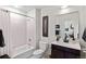 Modern bathroom featuring a bathtub with shower, toilet, and vanity with dark wood cabinet at 1438 Little Raven St # 407, Denver, CO 80202