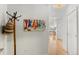 Hallway with light hardwood floors, white walls, and a hat rack at 1438 Little Raven St # 407, Denver, CO 80202