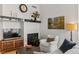 Living room with modern furniture, hardwood floors, and a decorative fireplace at 1438 Little Raven St # 407, Denver, CO 80202