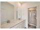 Bathroom with double vanity, quartz countertop and shower at 14586 W 91St Ave # B, Arvada, CO 80005