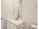 Clean bathroom with white vanity and quartz countertop at 14586 W 91St Ave # B, Arvada, CO 80005