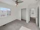 Well-lit bedroom with a closet and carpet at 18986 E 51St Pl, Denver, CO 80249