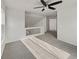 Bright bedroom with ceiling fan and carpet at 18986 E 51St Pl, Denver, CO 80249