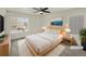 Virtually staged bedroom with a large bed, and plenty of natural light at 18986 E 51St Pl, Denver, CO 80249