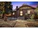 Brick home with stone pathway, landscaping, and a lovely front entrance at 1325 Clermont St, Denver, CO 80220