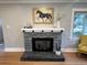 Elegant fireplace with stone surround and mantel at 1325 Clermont St, Denver, CO 80220