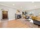 Spacious living room featuring hardwood floors and fireplace at 1325 Clermont St, Denver, CO 80220