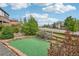 Backyard putting green with artificial turf, brick borders, and lush green landscaping at 15947 Bridle Ridge Dr, Monument, CO 80132