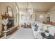 Cozy living room with stone fireplace, comfortable seating, and decorative accents at 15947 Bridle Ridge Dr, Monument, CO 80132