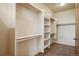 Spacious walk-in closet with built-in shelving and hanging rods for optimal organization at 15947 Bridle Ridge Dr, Monument, CO 80132