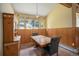 Cozy dining area bathed in natural light from large windows, creating a warm and inviting atmosphere at 5 Ronnie Rd, Golden, CO 80403