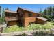 Rustic wooden house with a charming deck surrounded by trees and natural foliage at 5 Ronnie Rd, Golden, CO 80403