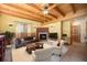 Inviting living room with wood-beamed ceiling, fireplace, and comfortable seating area perfect for relaxation at 5 Ronnie Rd, Golden, CO 80403