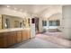 Large bathroom with a double sink vanity, separate tub, and an exit to the backyard at 5 Ronnie Rd, Golden, CO 80403