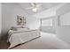 Bright bedroom with a vaulted ceiling, ceiling fan, and a large window at 10010 E Gunnison Pl # 707, Aurora, CO 80247