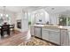 Bright, open kitchen with wood floors, granite countertops, stainless steel appliances and a fireplace at 10010 E Gunnison Pl # 707, Aurora, CO 80247