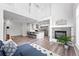 Bright and open living space featuring high ceilings, a fireplace, and a modern kitchen at 10010 E Gunnison Pl # 707, Aurora, CO 80247