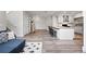 Open-concept living space with a view of the kitchen and comfortable seating area at 10010 E Gunnison Pl # 707, Aurora, CO 80247