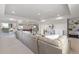 Large basement with a sectional sofa, game area, walkout access, and tasteful decorations at 338 Sage Grouse Cir, Castle Rock, CO 80109