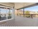Spacious covered deck with wood railings and views of the landscape in a desirable location at 338 Sage Grouse Cir, Castle Rock, CO 80109