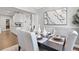 Formal dining room featuring sleek table setting, modern art, and easy access to kitchen at 338 Sage Grouse Cir, Castle Rock, CO 80109