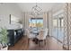 Cozy dining area boasts natural light, stylish furnishings, and sliding doors to the outside at 338 Sage Grouse Cir, Castle Rock, CO 80109