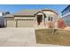 Charming single-Gathering home with a three-car garage, stone accents, and well-maintained landscaping at 338 Sage Grouse Cir, Castle Rock, CO 80109