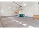 This garage features a storage system on a track with lots of space for multiple vehicles at 338 Sage Grouse Cir, Castle Rock, CO 80109
