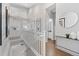 Hallway with stairway, white railings, hardwood flooring and a view to other rooms at 338 Sage Grouse Cir, Castle Rock, CO 80109