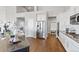 Modern kitchen featuring stainless steel appliances, white cabinets and hardwood floors at 338 Sage Grouse Cir, Castle Rock, CO 80109