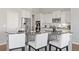 Bright kitchen featuring stainless steel appliances, sleek countertops, and ample white cabinetry at 338 Sage Grouse Cir, Castle Rock, CO 80109