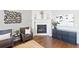 Living room featuring a fireplace, hardwood floors, and contemporary decor at 338 Sage Grouse Cir, Castle Rock, CO 80109