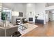 Spacious living room featuring a fireplace, hardwood floors, and contemporary decor at 338 Sage Grouse Cir, Castle Rock, CO 80109