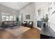 Bright living room with hardwood floors, fireplace, tall ceilings and large windows at 338 Sage Grouse Cir, Castle Rock, CO 80109