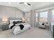 Spacious main bedroom featuring large windows, plush carpeting, and decorative wall paneling at 338 Sage Grouse Cir, Castle Rock, CO 80109