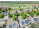 Aerial view of a neighborhood with solar panels and a nearby park at 10877 W 55Th Ln, Arvada, CO 80002