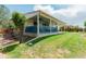 Backyard area with green grass and blue patio deck at 10877 W 55Th Ln, Arvada, CO 80002