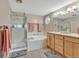 Bathroom with shower, soaking tub, double vanity, and tiled floor at 10877 W 55Th Ln, Arvada, CO 80002