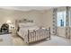 Bedroom with bed, carpet, and natural light at 10877 W 55Th Ln, Arvada, CO 80002